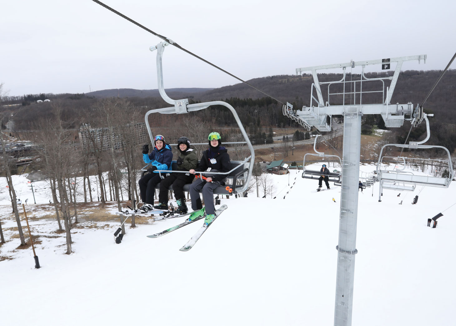 Three kids on ski lift