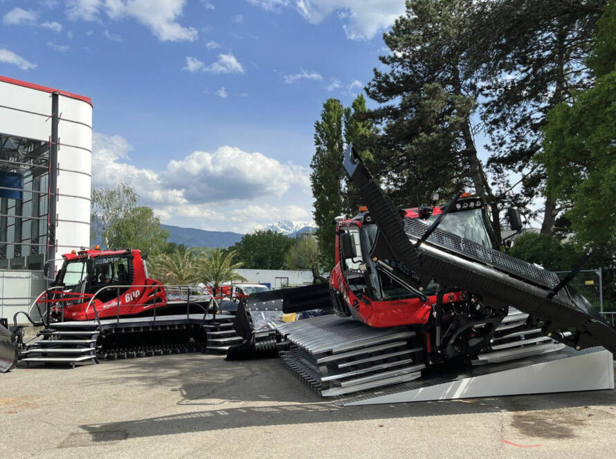 Two PistenBully snow groomers on display