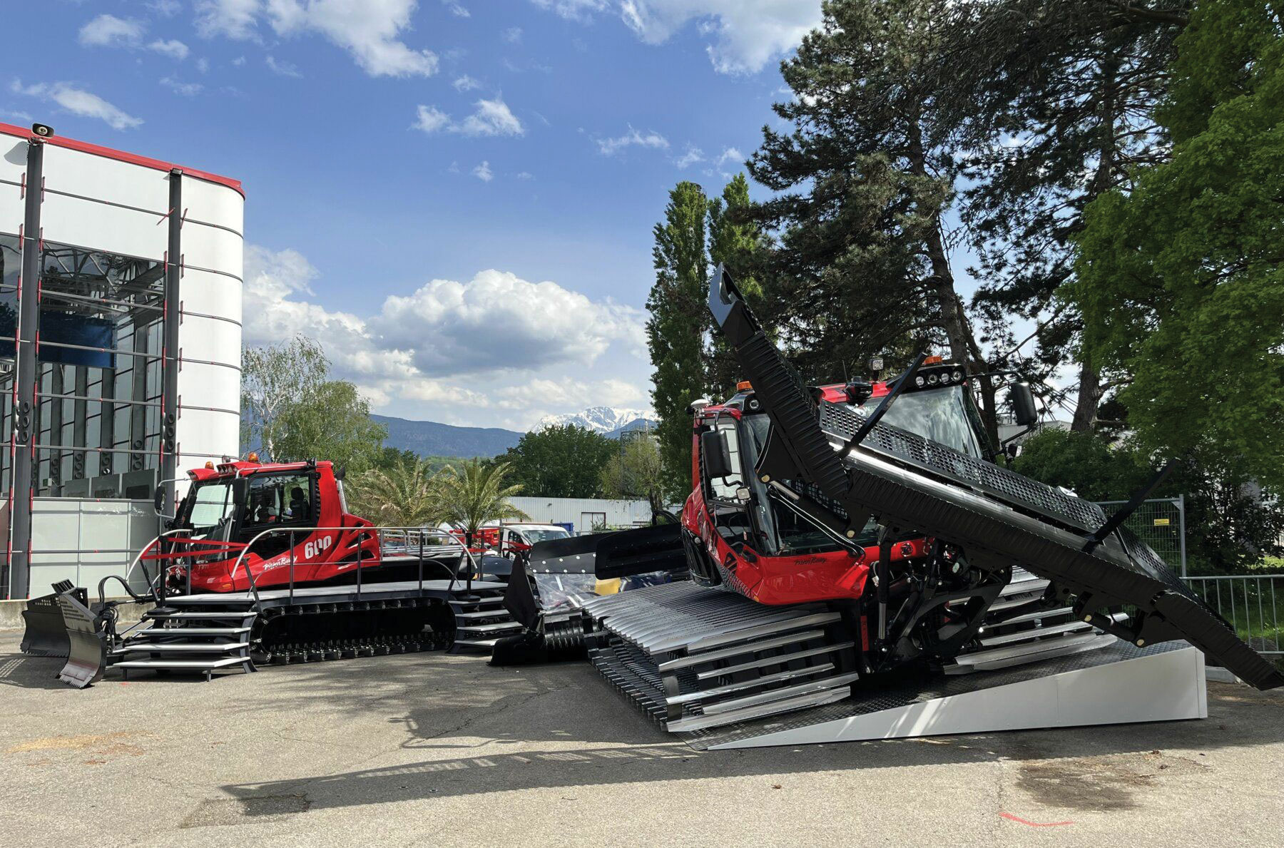 Two PistenBully snow groomers on display