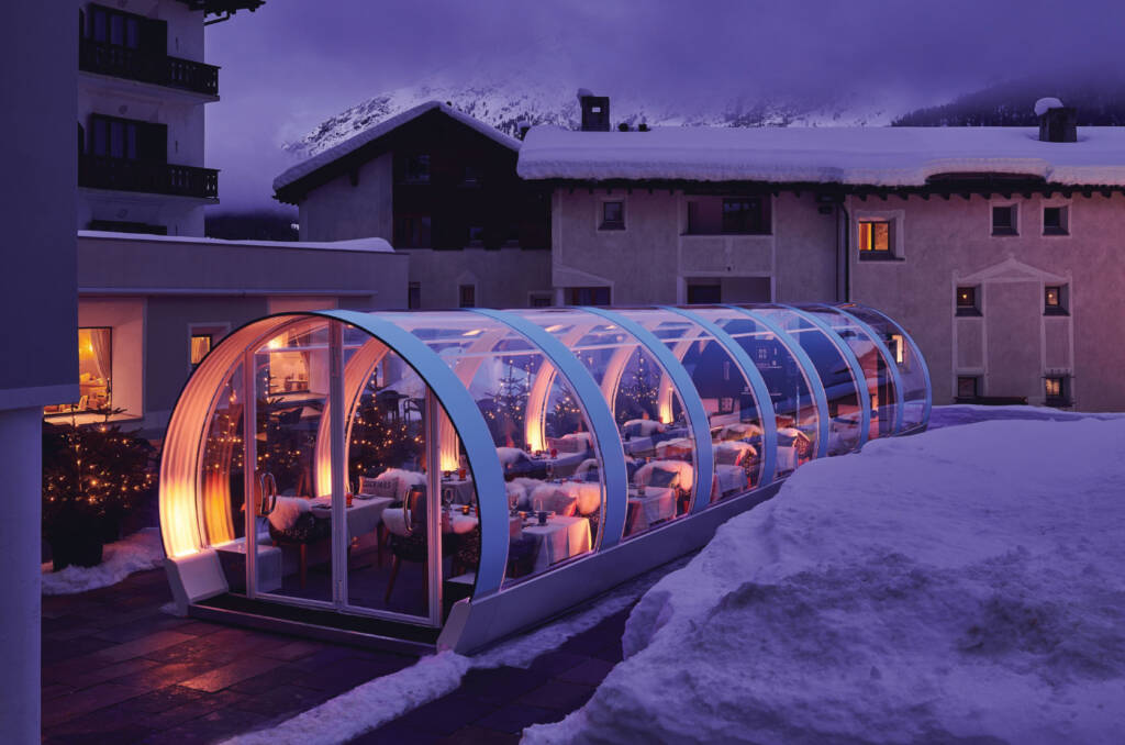 Exterior photo of glamorous, tube shaped restaurant