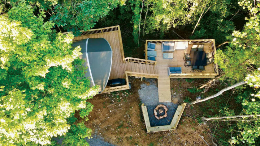 Overhead aerial view of wood deck, chairs and fire pit
