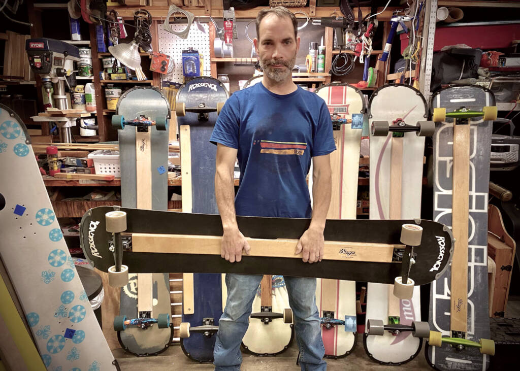 Roberto Smith in workshop with Alegre boards in background