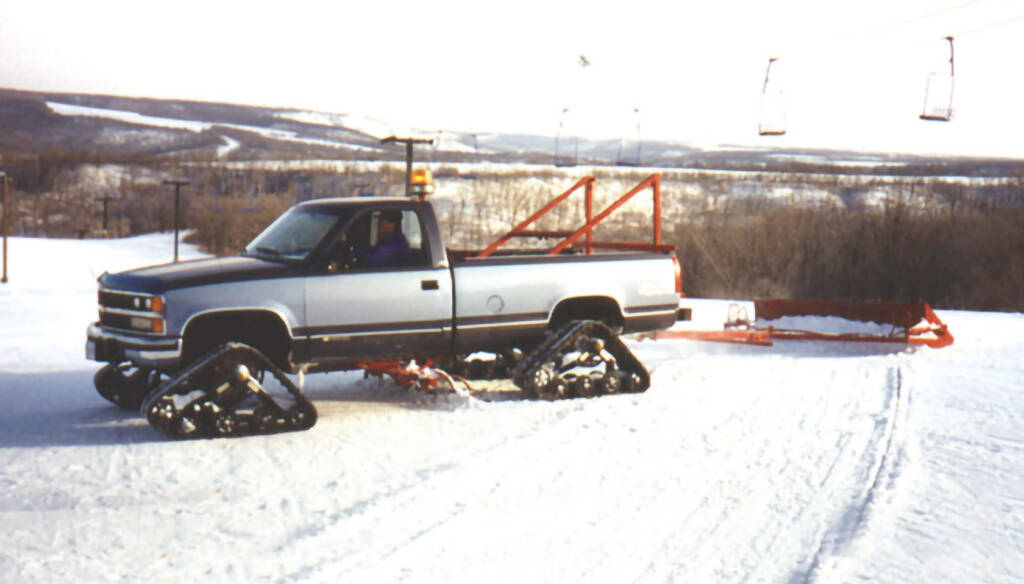 Mattracks rubber track conversion system installed on pickup truck