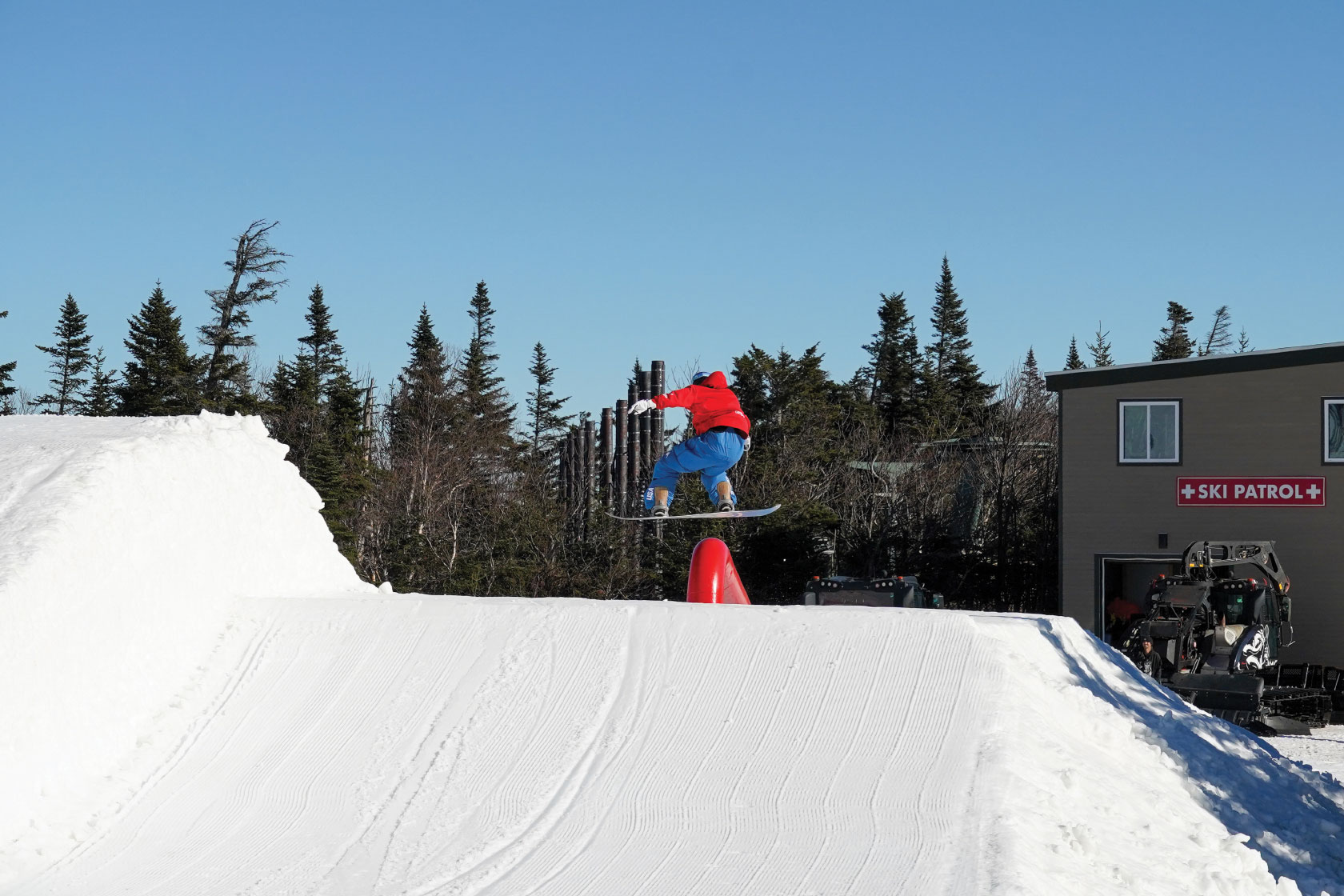 Snowboarder getting air in snowboard park