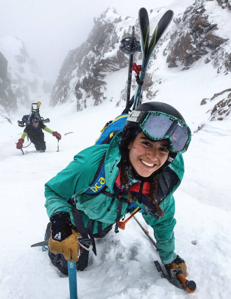 Maddie Miller climbing mountainside with another climber behind her