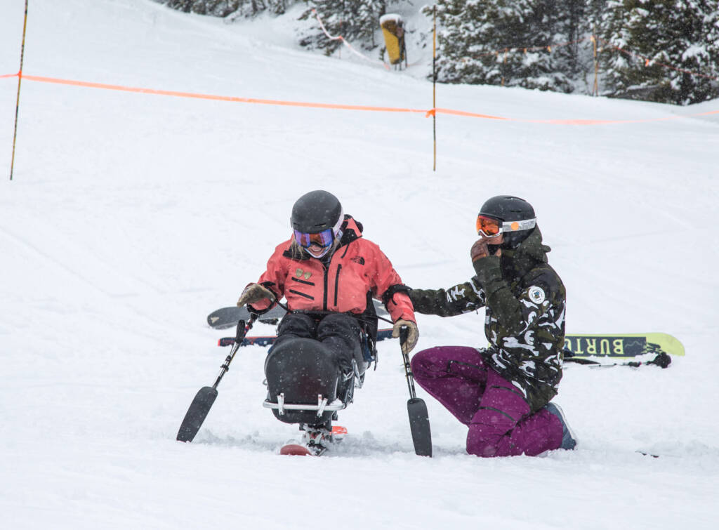 Student and teach on snow slope