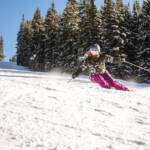 Skier carving down the slope