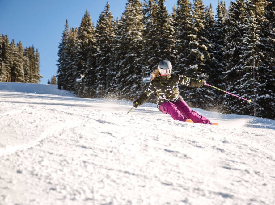 Skier carving down the slope